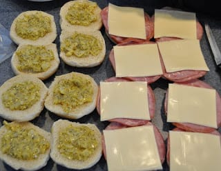 Open face freezer ham sandwiches with filling cheese and meat on them