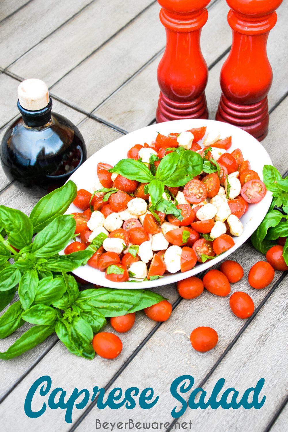 Caprese Salad is a simple fresh tomato salad recipe made with fresh tomatoes, basil, and mozzarella with balsamic vinegar and olive oil for a quick and easy side dish all summer long.