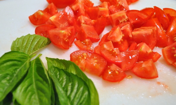 Fresh tomatoes out of the garden with fresh basil and mozzarella make the simplest and easiest caprese salad recipe.