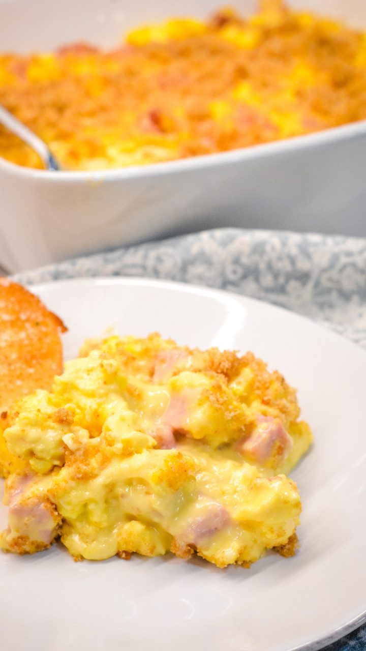 Cheesy ham and scrambled egg casserole recipe is a breadless egg and ham bake made the night before with scrambled eggs and a velvety cheese sauce and a bread crumb topping. This is a great recipe for Easter or Christmas Breakfast morning.
