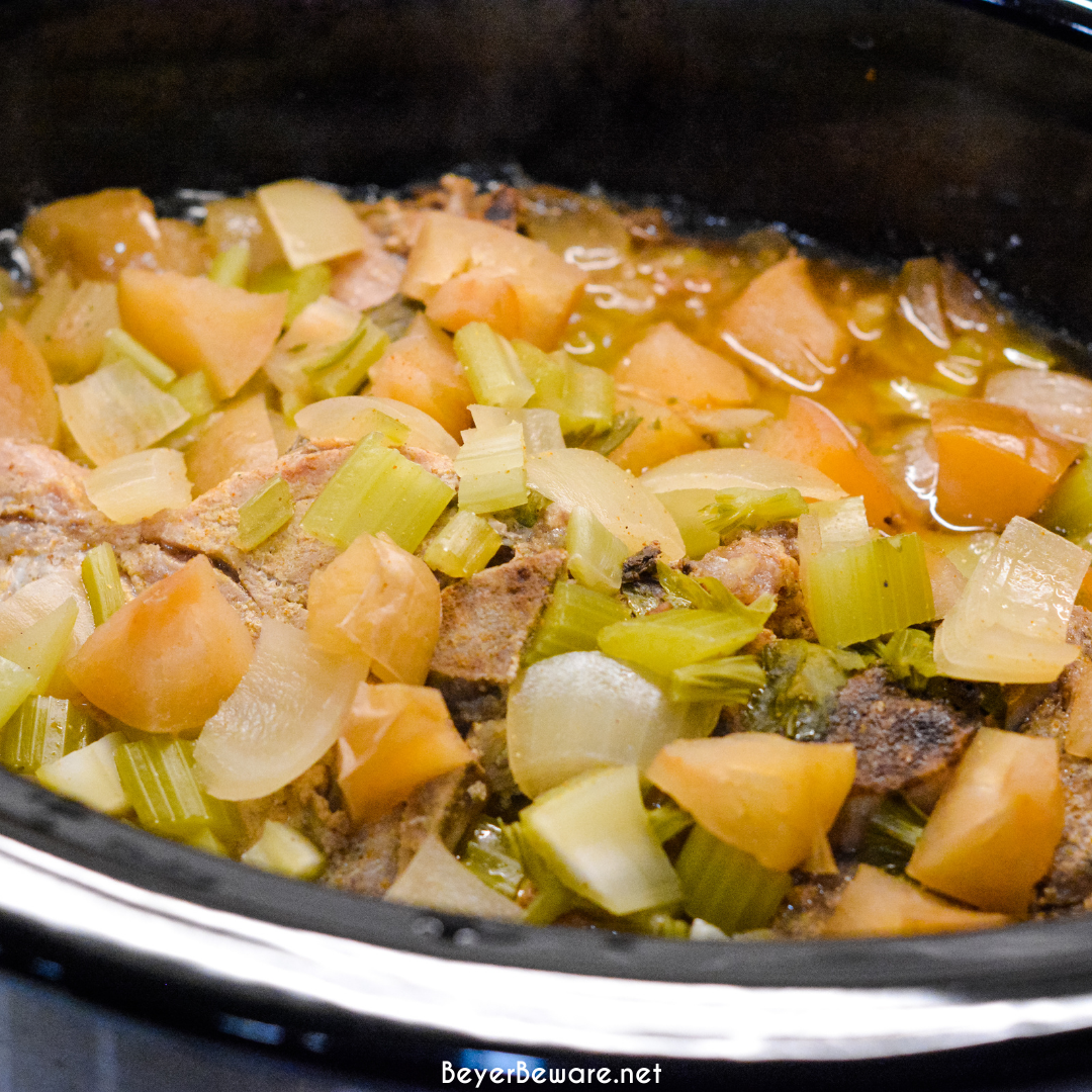 Crock pot apple pork chops is a flavorful crock pot pork chop recipe with lots of apples, onions, celery and cornbread stuffing.