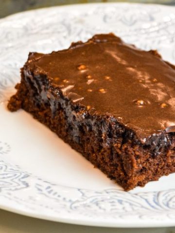 Grandma's Texas Sheet Cake is a tried and true chocolate sheet cake recipe with all the cocoa and butter in the recipe to make it so outrageously delicious.