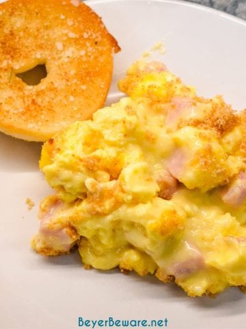 Cheesy ham and scrambled egg casserole recipe is a breadless egg and ham bake made the night before with scrambled eggs and a velvety cheese sauce and a bread crumb topping. This is a great recipe for Easter or Christmas Breakfast morning.