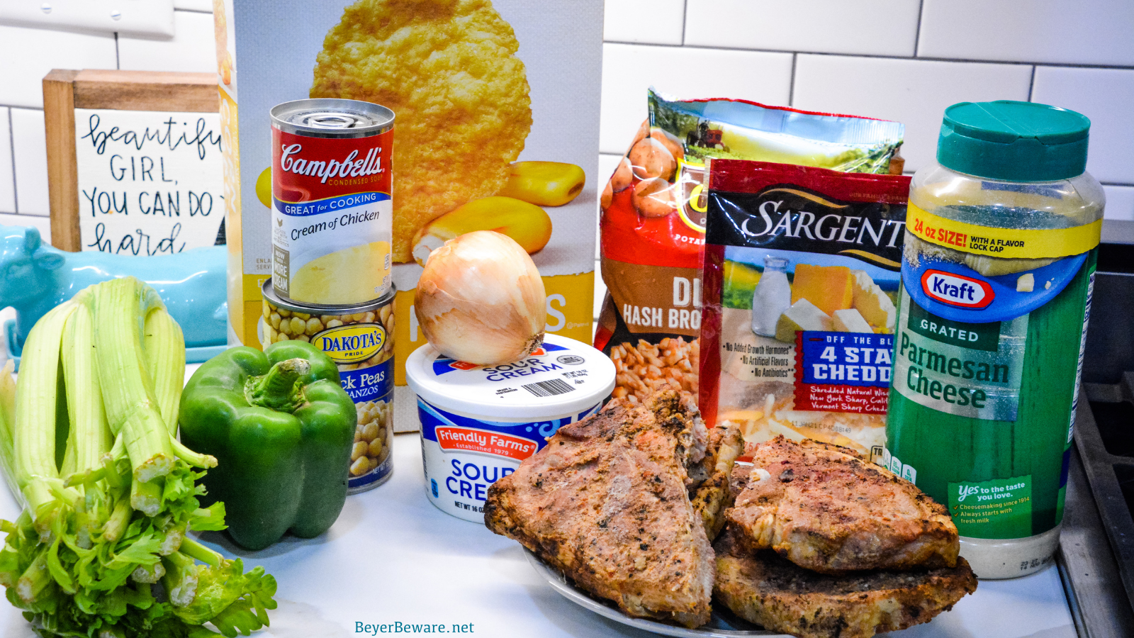 Cheesy pork chop casserole is the perfect way to use leftover pork chops and is a great recipe to sneak extra veggies and beans in your kid's diets.