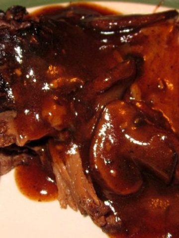 Crock Pot Coffee Beef Roast combines coffee, mushroom, onions, garlic to create a rich and flavorful sauce for a beef roast to slow cook in all day creating a tender and juicy crock pot roast. #CrockPot #Roast #Beef #BeefRoast