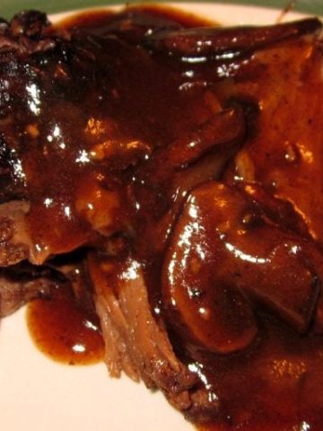 Crock Pot Coffee Beef Roast combines coffee, mushroom, onions, garlic to create a rich and flavorful sauce for a beef roast to slow cook in all day creating a tender and juicy crock pot roast. #CrockPot #Roast #Beef #BeefRoast