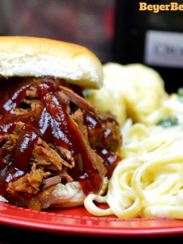 This slow cooker root beer beef bbq recipe is the perfect combination of sweet and heat with a hint of smoke to leave your summer BBQ cravings satisfied. 