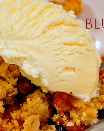 The combination of peaches and blueberry makes this easy peach blueberry crisp recipe topped with ice cream a perfect summer dessert.