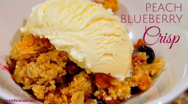 The combination of peaches and blueberry makes this easy peach blueberry crisp recipe topped with ice cream a perfect summer dessert.