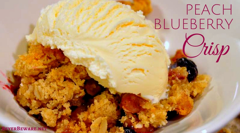The combination of peaches and blueberry makes this easy peach blueberry crisp recipe topped with ice cream a perfect summer dessert.