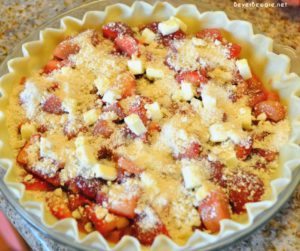 Strawberry rhubarb pie is a phenomenon in the spring and early summer in the midwest and this crumb topped version of the sweet and tart pie is so easy to make.