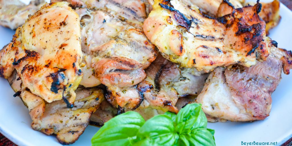 Garlic Lemon Basil Grilled Chicken is the perfect summer dinner idea. The marinade is made with white wine, lemon, limes, mustard, garlic, and basil.
