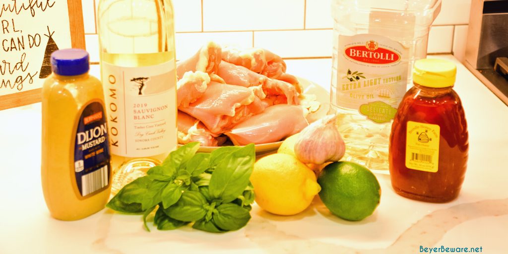 Garlic Lemon Basil Grilled Chicken is the perfect summer dinner idea. The marinade is made with white wine, lemon, limes, mustard, garlic, and basil. 