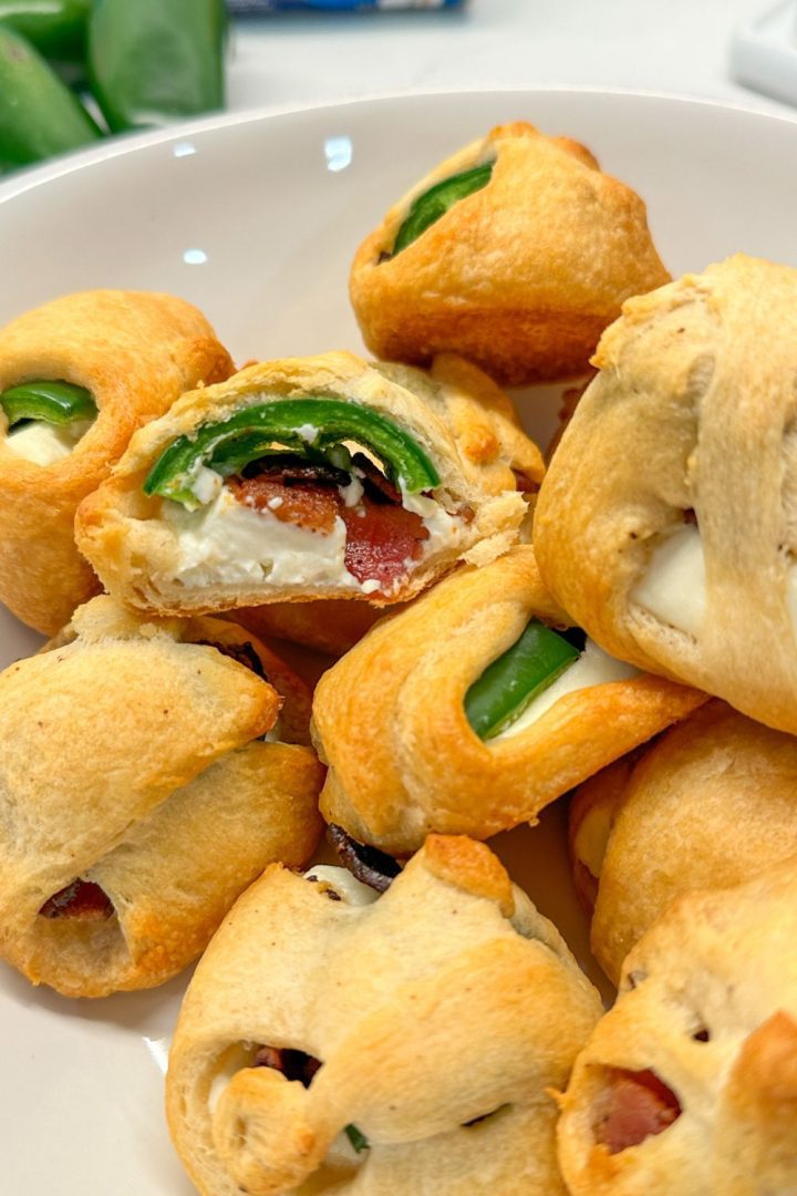 This unique jalapeño popper recipe is just four ingredients - crescent rolls, cream cheese, bacon, and jalapeños.