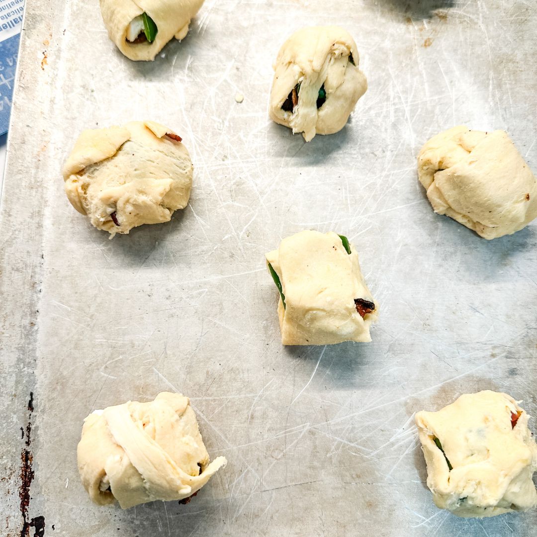 Then pull up the edges around all the feelings to form little pillows of jalapeno poppers.  