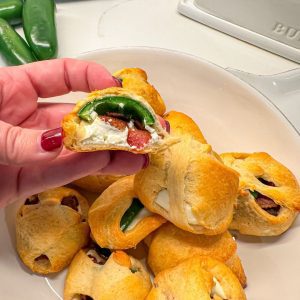 This unique jalapeño popper recipe is just four ingredients - crescent rolls, cream cheese, bacon, and jalapeños.