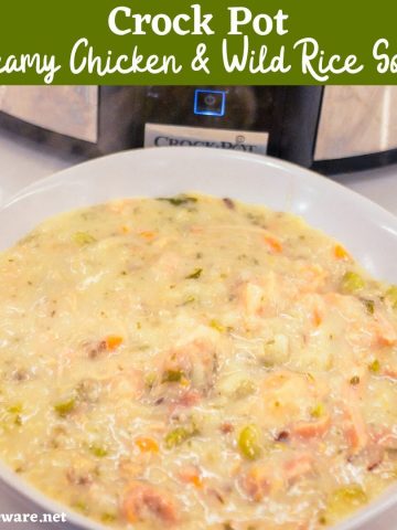 Crock pot creamy chicken and wild rice soup is slow-cooked all day in a base of carrots, celery, onions, and garlic and then made creamy with a simple white sauce to quickly become your family\'s favorite hearty soup recipe.