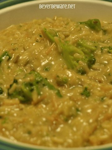 One pan cheesy broccoli, rice, and walnut casserole combines a boxed rice pilaf mix with steamed broccoli, cheese and creamed soup for an easy, fancied up side dish. #sidedish #Ricepilaf #Broccoli #cheese