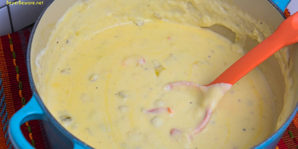 Mexican mashed potatoes are the copycat recipe of Abuelo's papa con chile made with mashed potatoes, garlic, peppers, green chiles, sour cream, onions, and cheese.