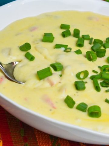 Mexican mashed potatoes are the copycat recipe of Abuelo's papa con chile made with mashed potatoes, garlic, peppers, green chiles, sour cream, onions, and cheese.