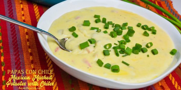 Mexican mashed potatoes are the copycat recipe of Abuelo's papa con chile made with mashed potatoes, garlic, peppers, green chiles, sour cream, onions, and cheese.