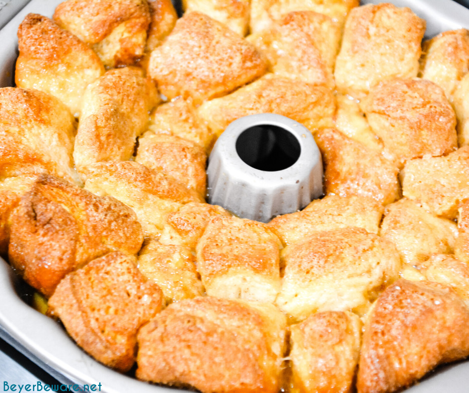 Monkey bread is a caramel pull-apart bread made with Grands biscuits, butter, sugar, and cinnamon then baked in a bundt cake pan for a gooey breakfast bread.