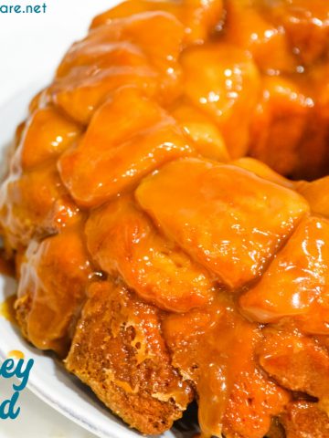 Monkey bread is a caramel pull-apart bread made with Grands biscuits, butter, sugar, and cinnamon then baked in a bundt cake pan for a gooey breakfast bread.