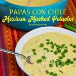 Mexican mashed potatoes are the copycat recipe of Abuelo's papa con chile made with mashed potatoes, garlic, peppers, green chiles, sour cream, onions, and cheese.