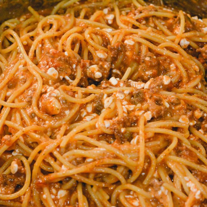 Then mix the meat sauce with the cheesy spaghetti noodles.