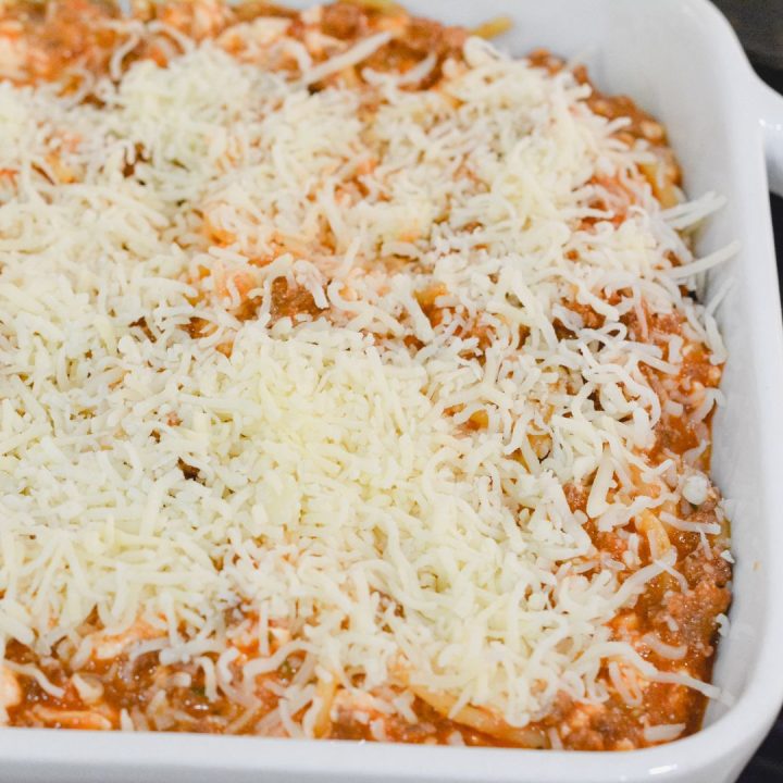 Top the baked spaghetti with another cup to cup and a half of mozzarella cheese and half a cup of Parmesan cheese. 