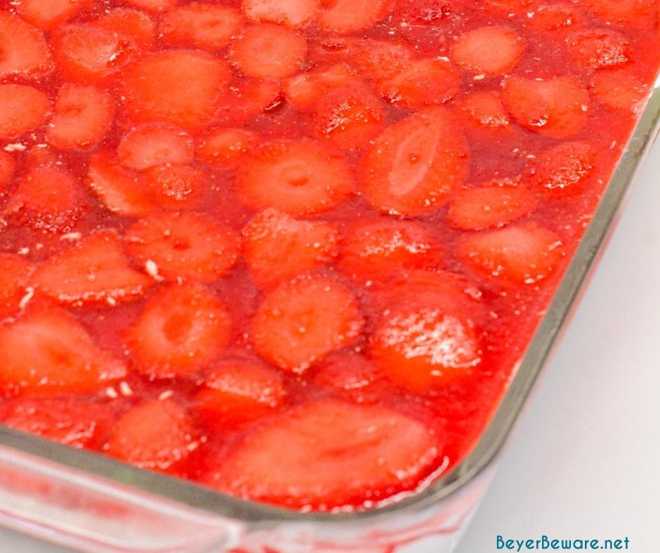 Strawberry Pretzel salad can be a dessert or side made with a sweet and salty pretzel crust, cream cheese center, and strawberry and jello topping.