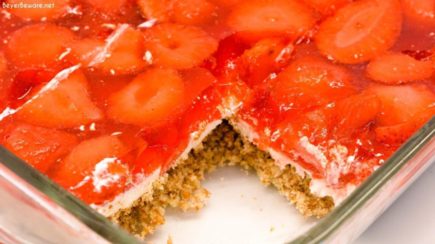 Strawberry Pretzel salad can be a dessert or side made with a sweet and salty pretzel crust, cream cheese center, and strawberry and jello topping.