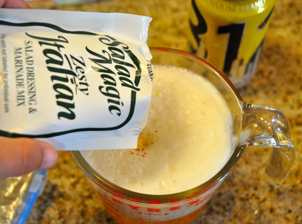 Pouring Italian seasoning into beer