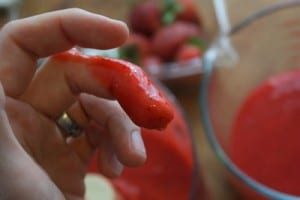 Strawberry puree on finger