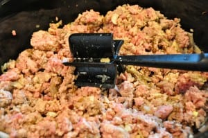 breaking up ground meat with a mix and chop
