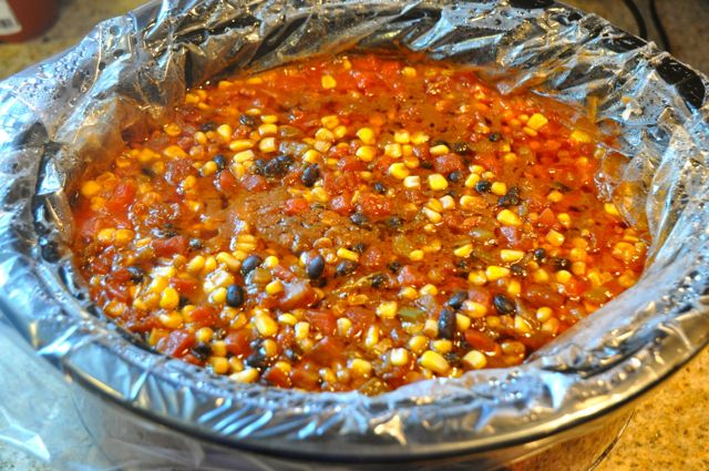 This easy Crock Pot Chicken Taco Bowls recipe that can feed a crowd and is gluten-free. This recipe will be your version of your favorite burrito bowl.