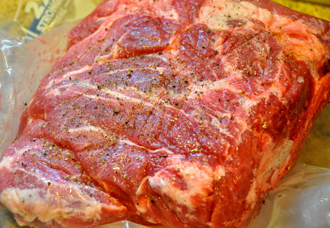 half of a pork shoulder with salt and pepper