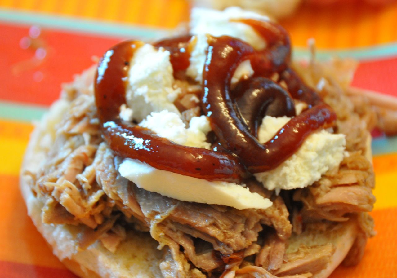 Crock Pot Dr. Pepper Pulled Pork with cheese and BBQ sauce