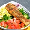 Blackened Fish Taco Salad recipe is a refreshing blend your favorite veggies and meat for a taco salad and dressed in a cilantro lime dressing.