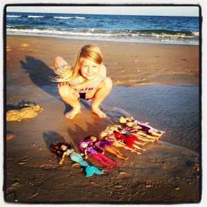 Playing with Barbies on the beach