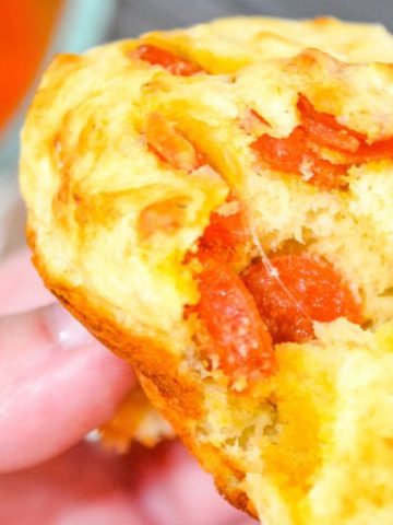 Pepperoni pizza muffins is a simple recipe made with lots of biscuit mix, pepperoni and cheese are a great lunch, dinner on the go or even pizza snack.