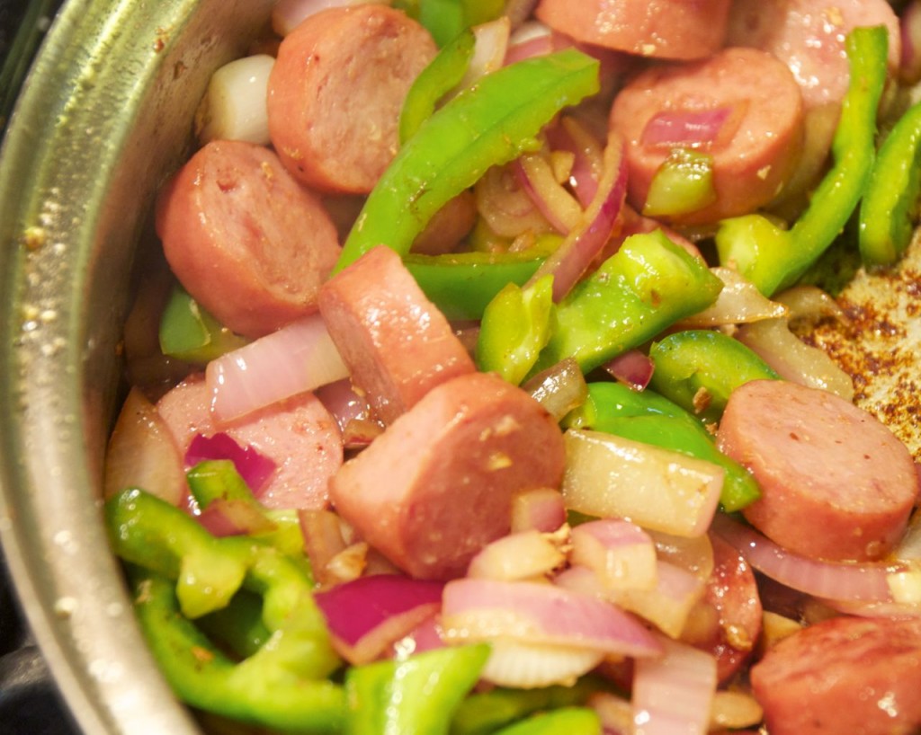 veggies and smoked sausage in skillet