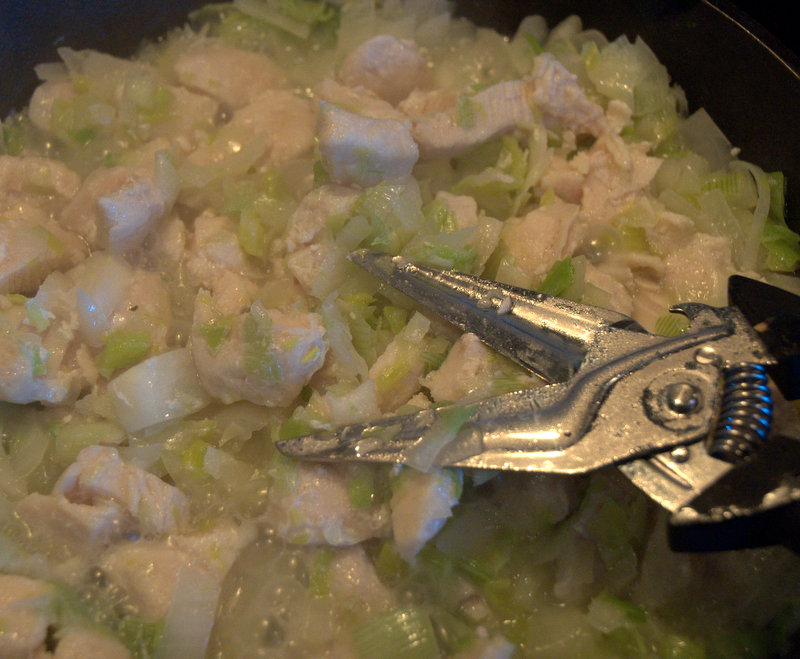 cutting up cooked chicken for white chili