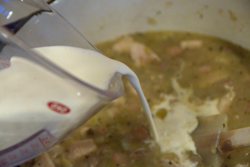 Adding cream to white chicken chili soup