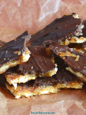 Saltine cracker toffee is a four-ingredient candy recipe that is easy to make with saltine crackers, butter, brown sugar, and chocolate chips and baked quickly before being broken into pieces.