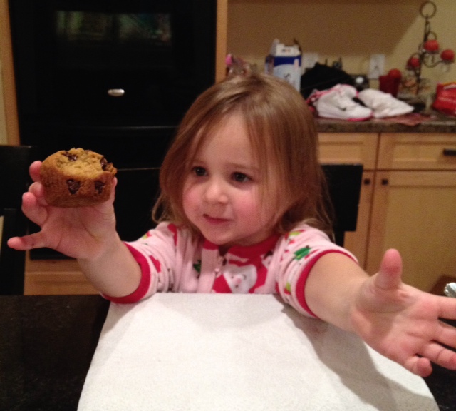 Miss A eating a warm muffin