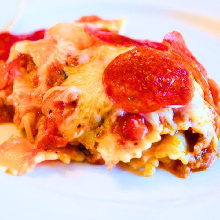 Meat lovers pizza casserole is a simple pizza pasta casserole recipe loaded with pepperoni and sausage, spaghetti sauce, and cheese.