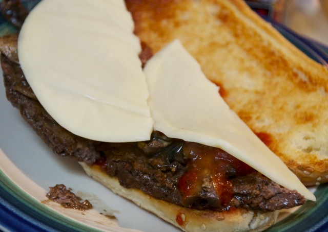 Cheese covered steak sandwich
