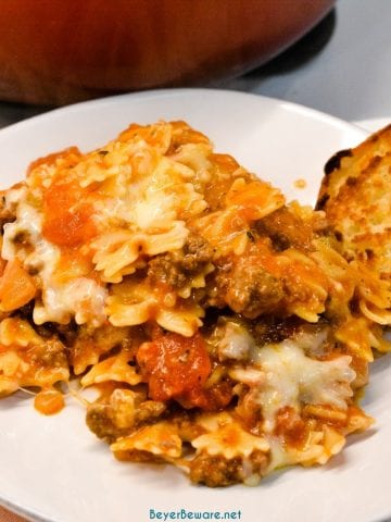 Easy Skillet lasagna is a quick one pan lasagna recipe made with ground beef and pasta with plenty of cheese and tomato sauce in less than 30 minutes to fill up your hungry family.