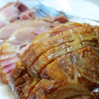 Crock Pot Garlic Honey Mustard Ham is an easy ham recipe combining honey mustard, garlic, and Worcestershire sauce for a flavorful Thanksgiving, Christmas or Easter ham.